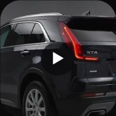 2019 Cadillac XT4 Luxury in black, rear three-quarter view, the cover of a second reel in a new style.